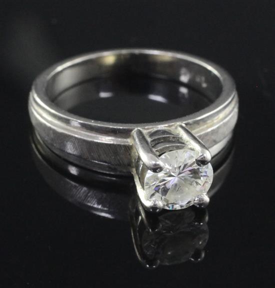 An 18ct gold and solitaire diamond ring, size M.